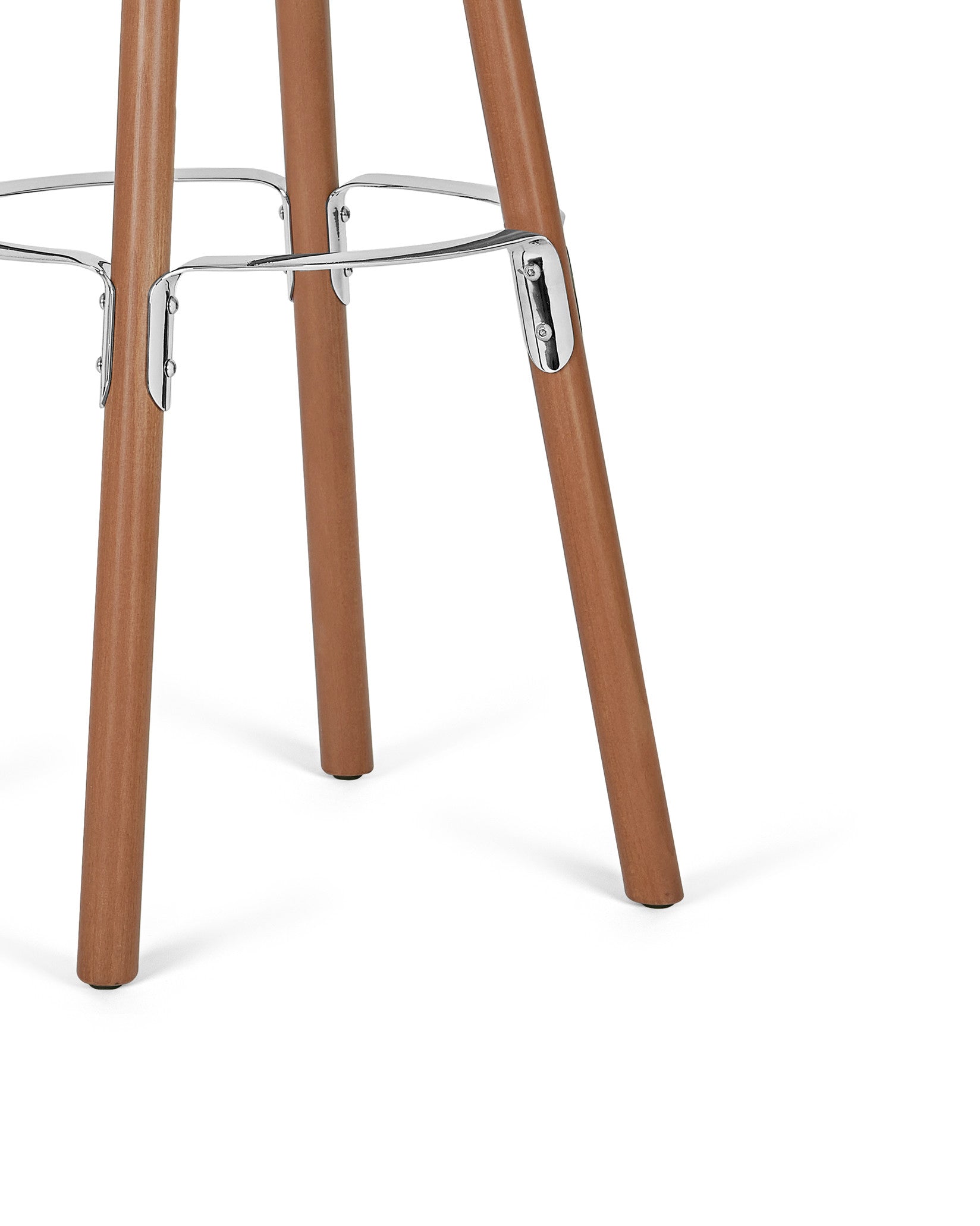 Brown wooden coat stand by Alessi with chrome footrests, cropped lower section.