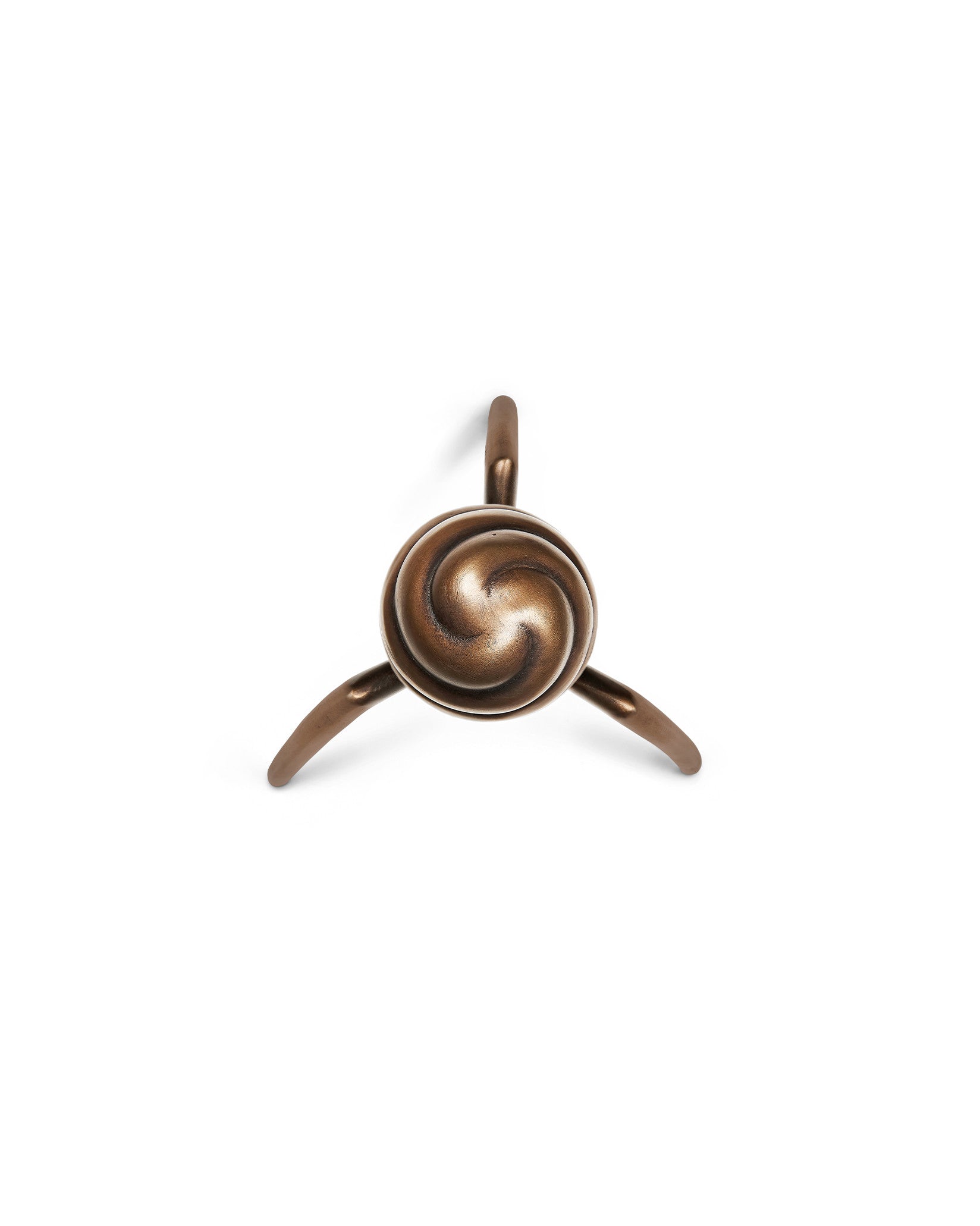 Bronze metallic juicer by Alessi with a spiral design and three tapered legs, viewed from above.