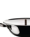 A polished stainless steel pot with a black exterior by Alessi, featuring a curved black handle and a dark bronze lid knob.