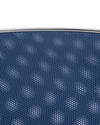 Blue Cohncave by Alessi, a perforated bowl with a silver metallic rim, revealing a white background through its small holes.