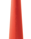 Matte, textured orange conical object by Alessi, with embossed text "ALESSI ITALY MIRIAM MIRRI (2002)".