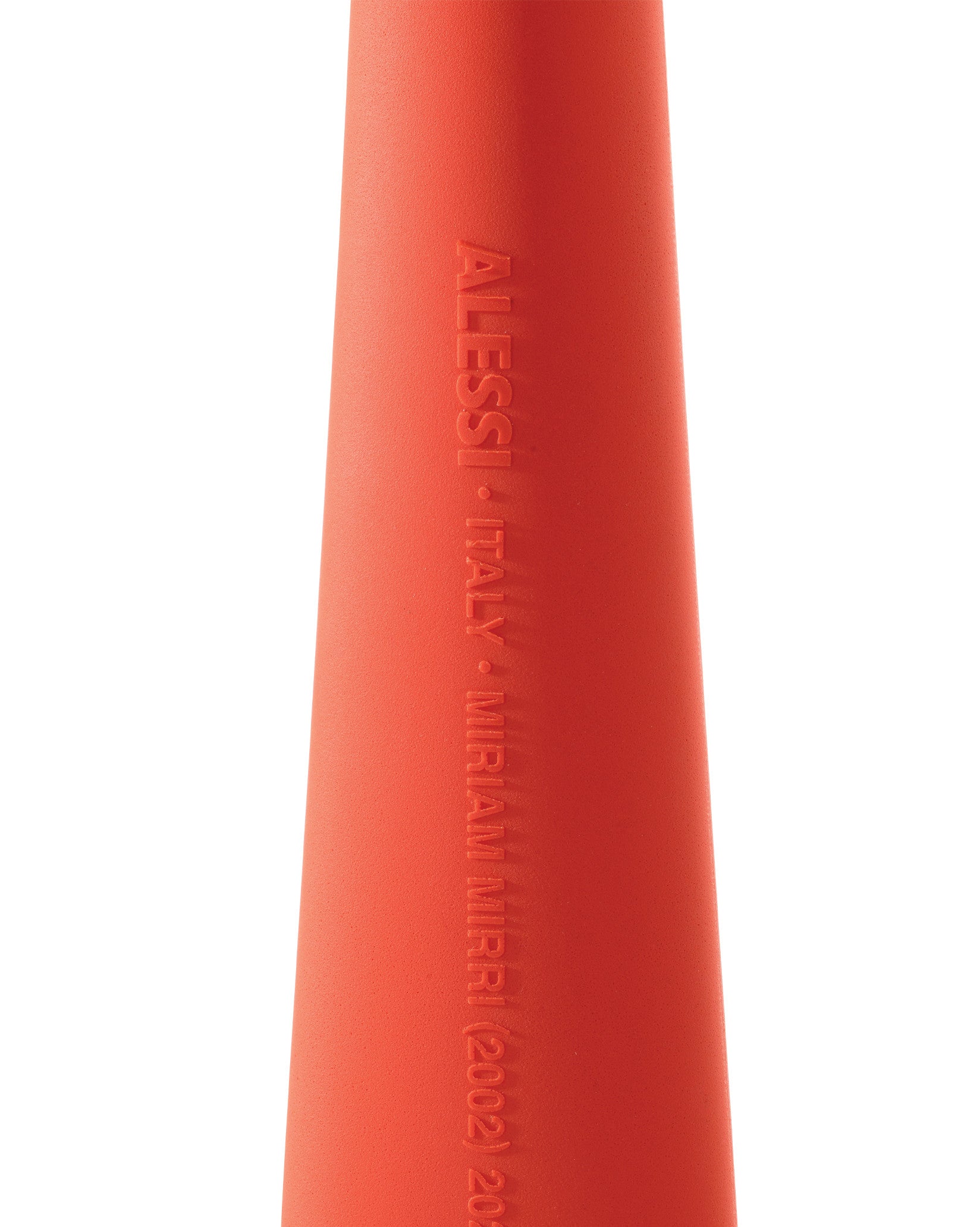 Matte, textured orange conical object by Alessi, with embossed text "ALESSI ITALY MIRIAM MIRRI (2002)".