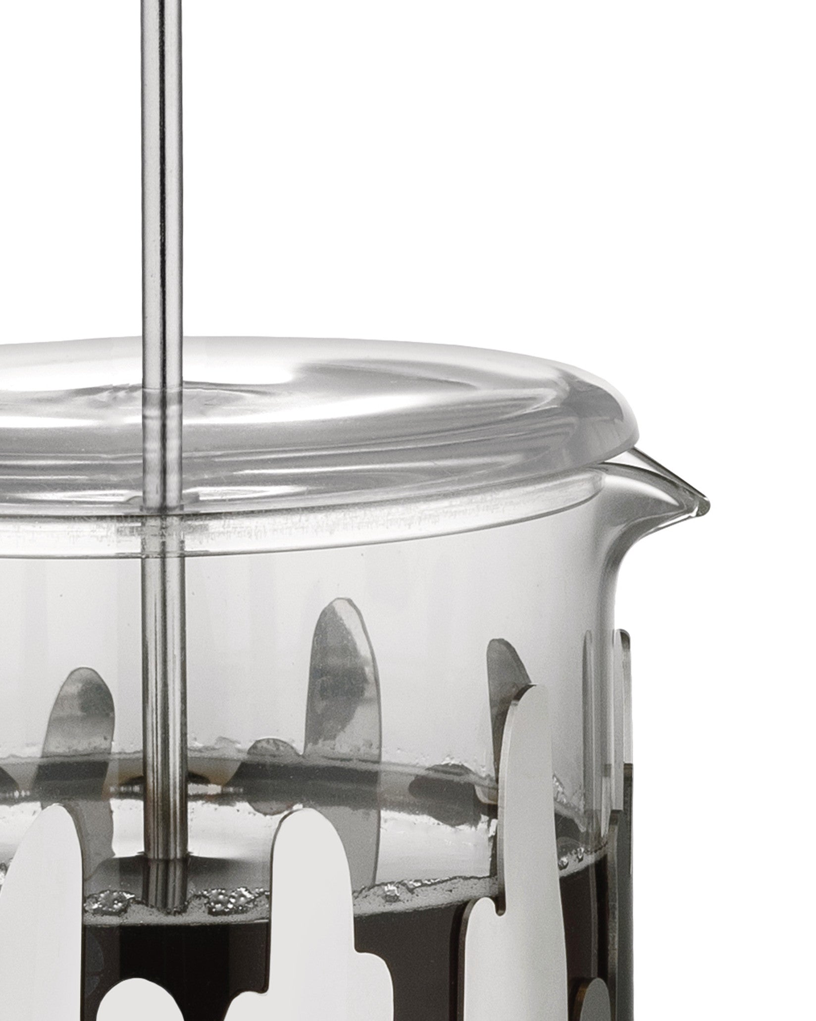 A clear glass French press coffee maker by Alessi, featuring a silver wavy metal frame, filled with coffee.