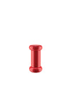 Red lacquered wood pushpin by Alessi with a distinctive spool shape, centered on a white background.