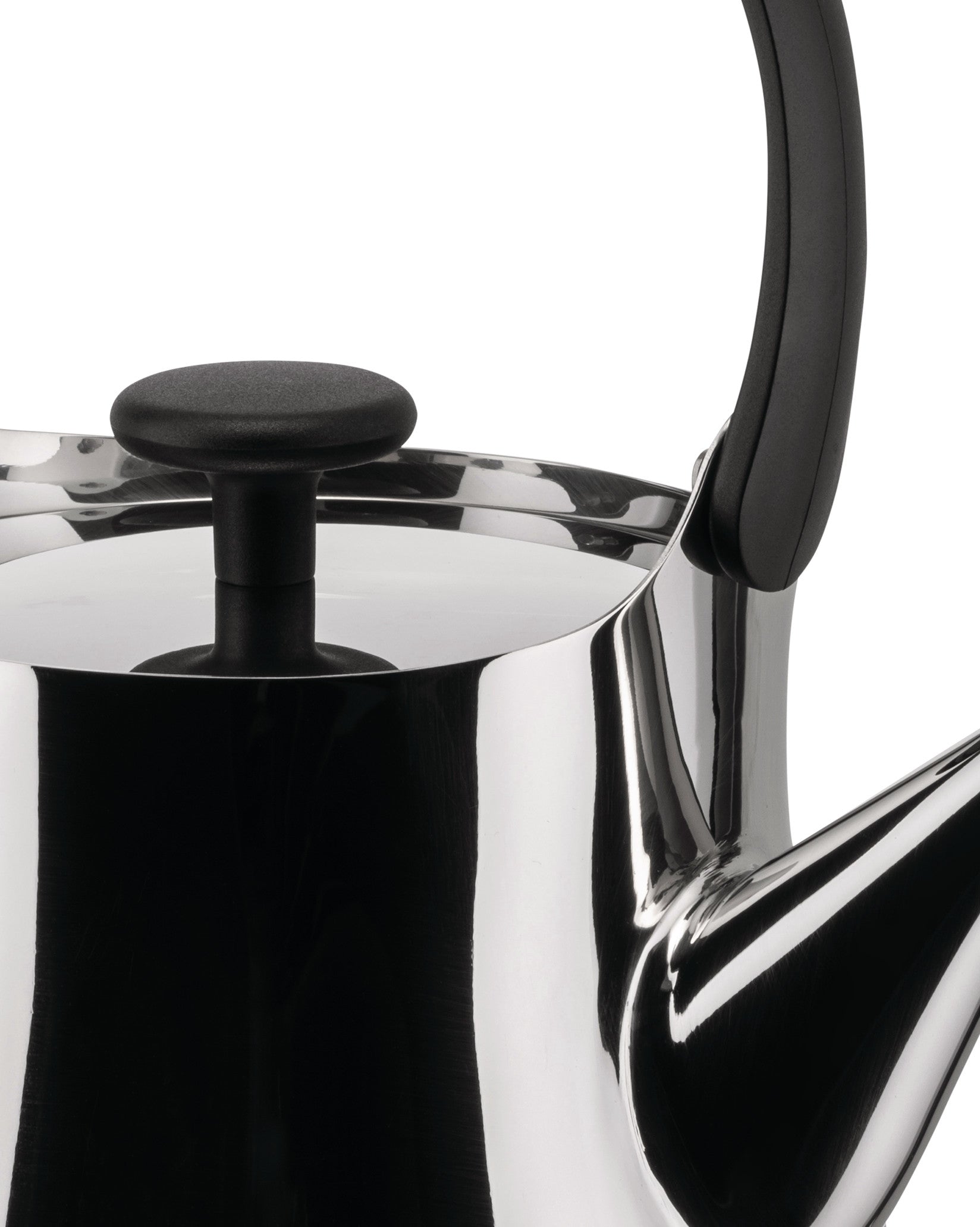 Stainless steel teapot by Alessi with a black handle and lid knob, in a close-up shot.