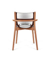 Wooden framed chair by Alessi with a unique polished silver, pan-like seat and backrest, back view.