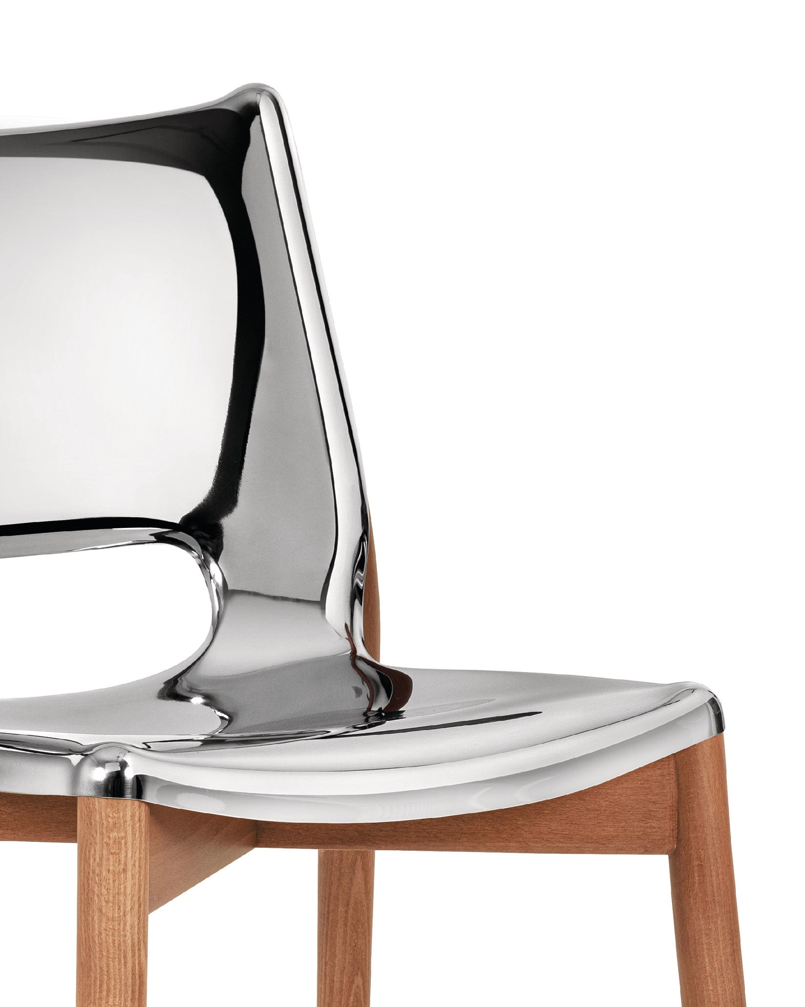 Sculpted chrome chair by Alessi with a reflective, melted-effect back and seat on light wooden legs.