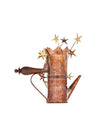 Copper coffee maker by Alessi with a wooden handle and golden star decorations emerging from a crown-shaped top.