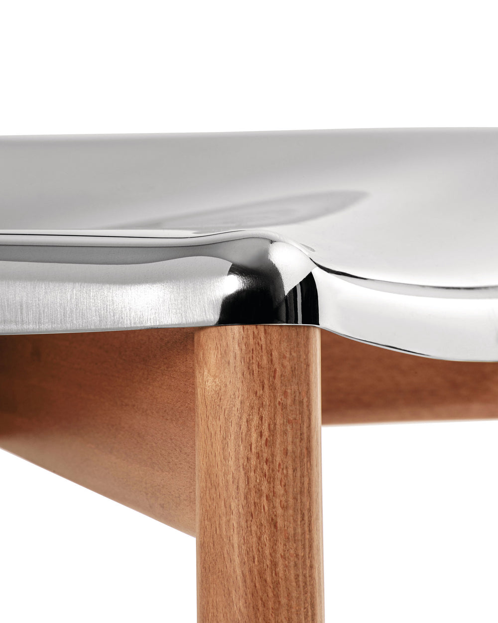 Shiny metallic and wood chair by Alessi, featuring a smooth curved seat and a round leg.