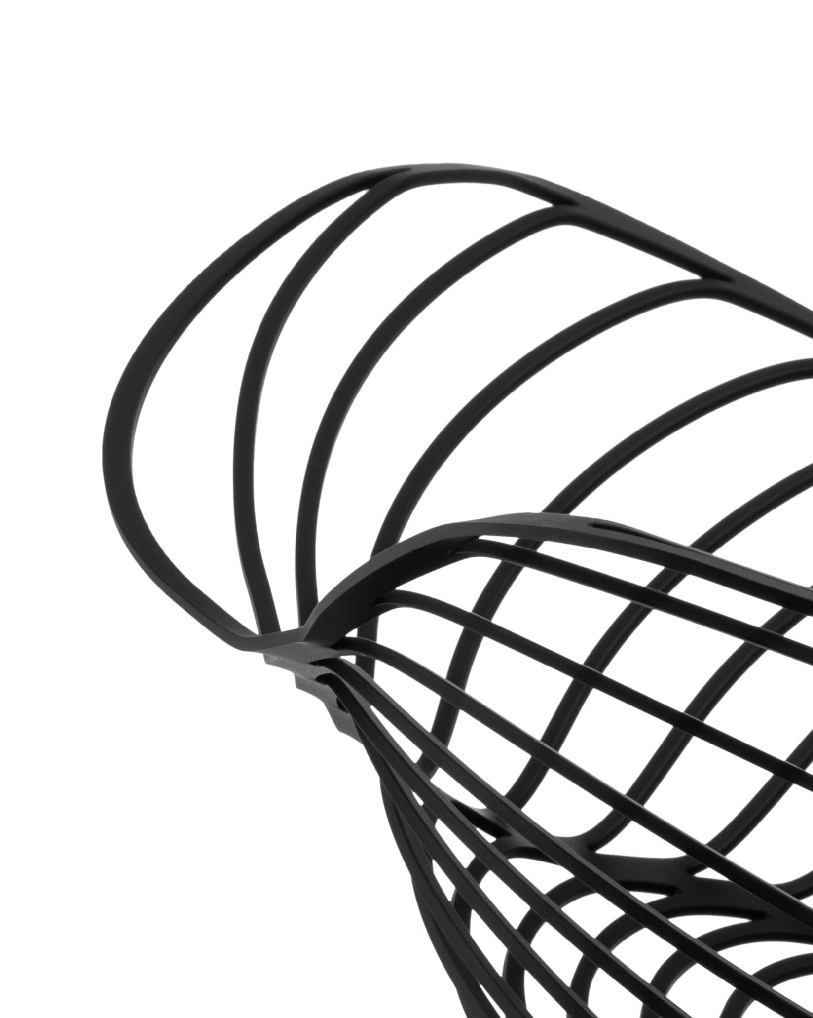 Black open-work fruit bowl by Alessi with intertwined strips, cropped angle.