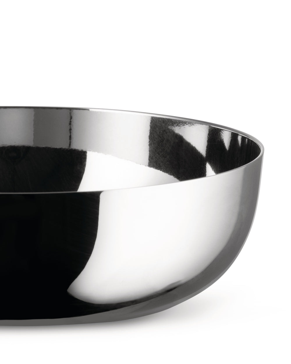 Silver metallic bowl by Alessi, cropped, reflecting abstract dark and white patterns.