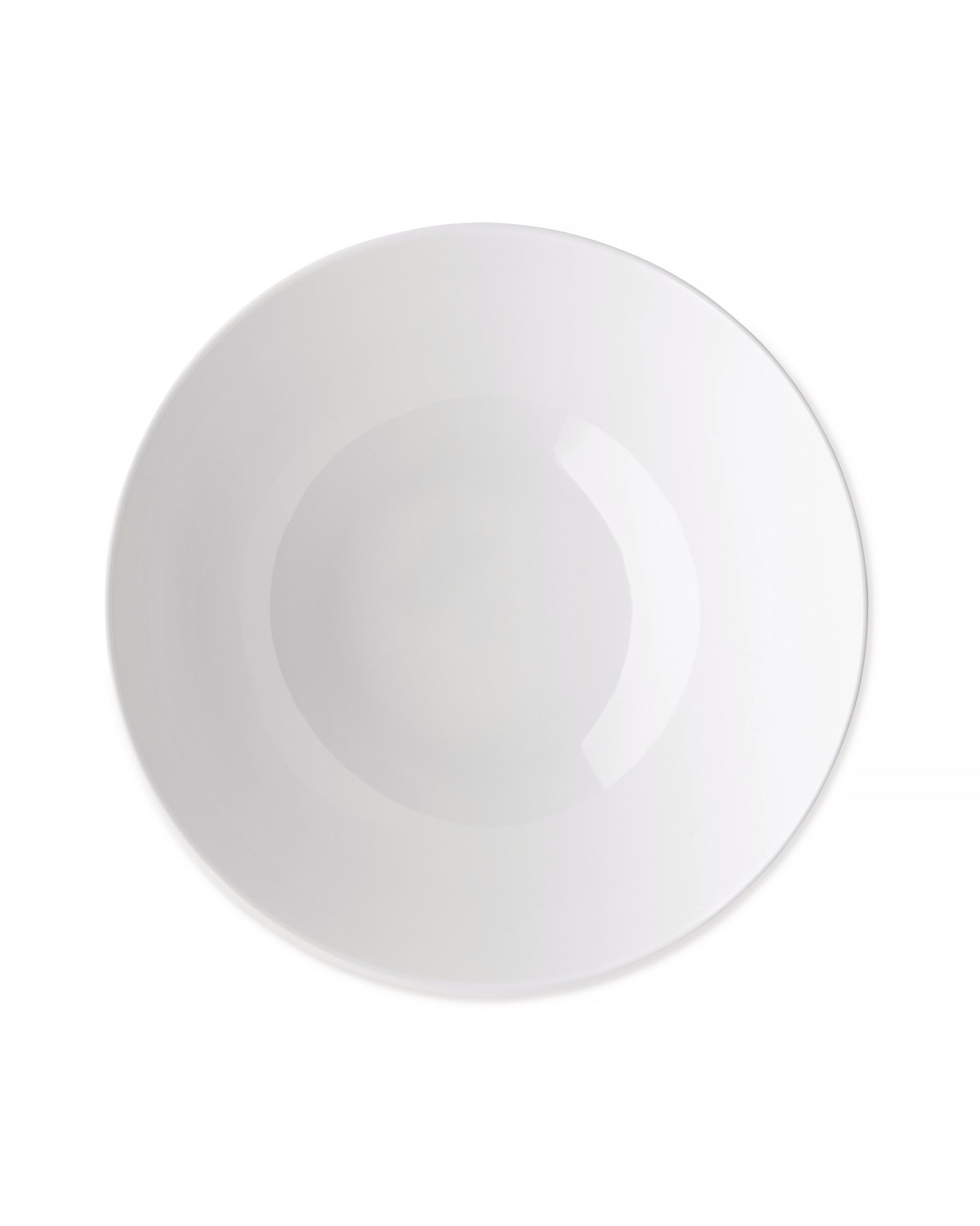 White ceramic bowl by Alessi, glossy and circular, viewed from above.