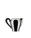 Bombé creamer by Alessi, polished silver with a sleek black handle and pouring spout.