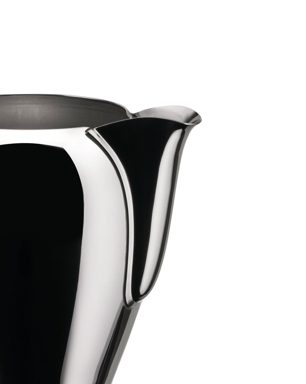 Chrome pitcher by Alessi with a sleek curved handle and elegant spout, cropped close-up.