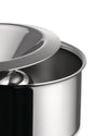 Polished stainless steel serving bowl by Alessi with a sleek, domed lid, in a close-up view.