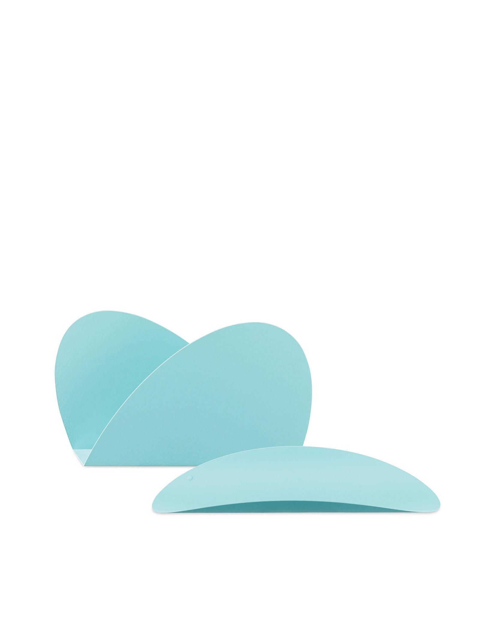 Two light blue elliptical shapes by Alessi, one standing upright and one lying flat, with a smooth matte texture.