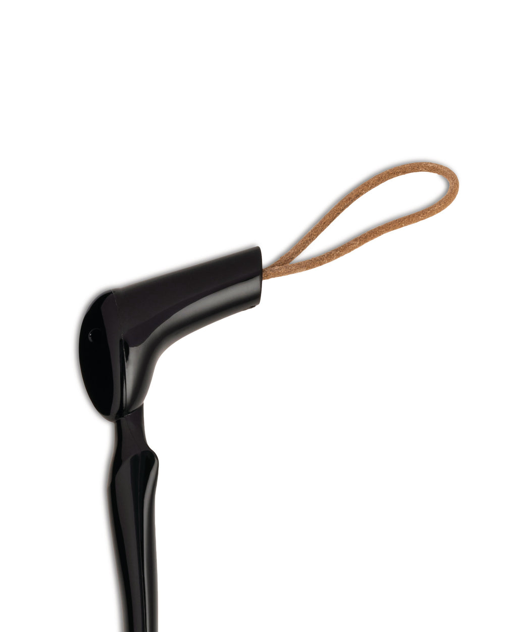Black glossy shoehorn by Alessi with a brown leather loop, shown in a partial view.