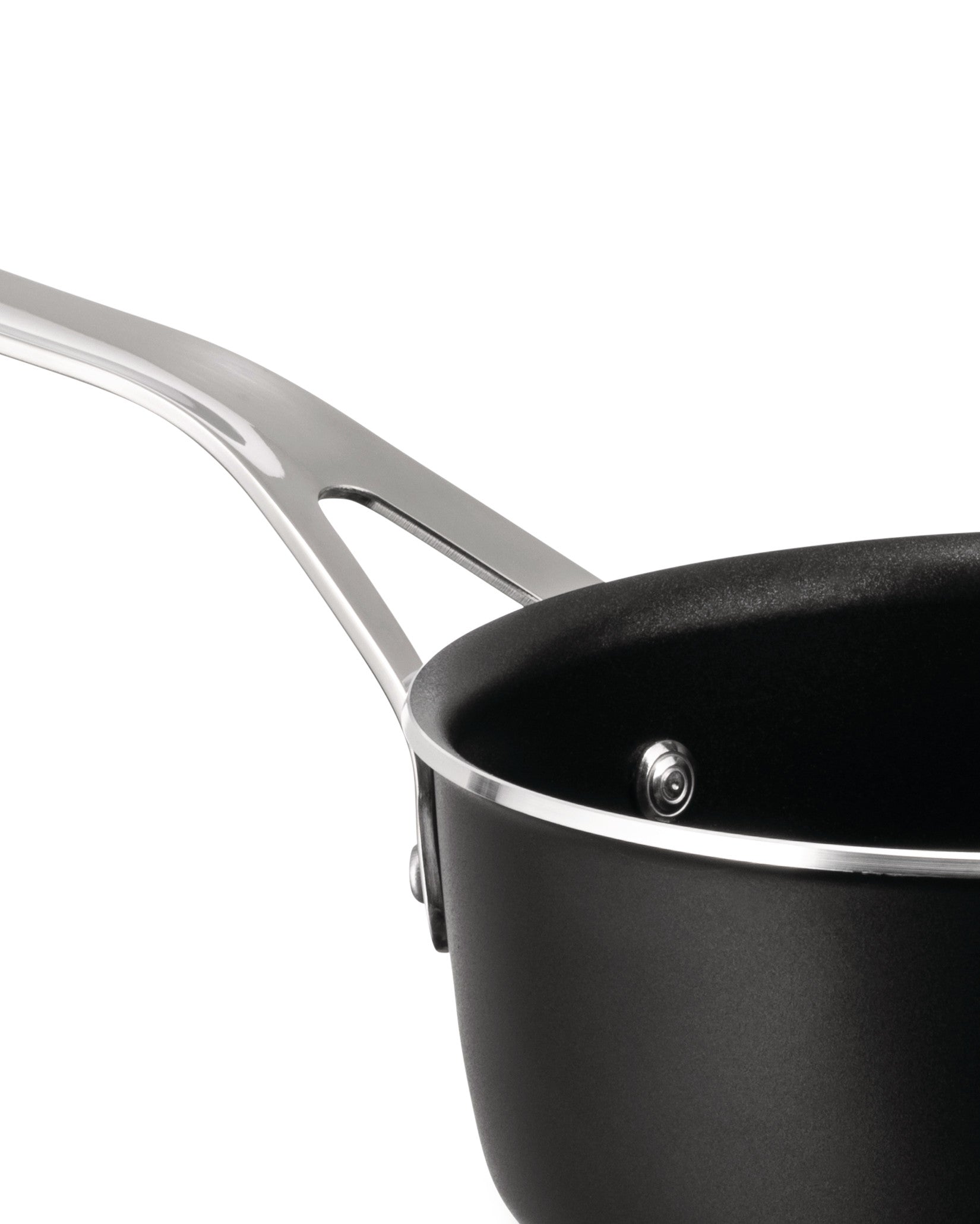 Black non-stick saucepan by Alessi with a polished silver-tone handle, shown in a cropped side view.