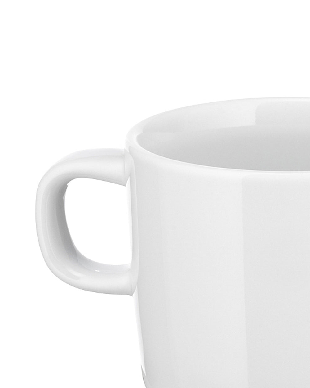 White ceramic cup by Alessi with a C-shaped handle, shown in a cropped side view.