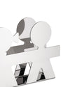Silver metal napkin holder by Alessi, featuring iconic Girotondo cutout figures and a reflective finish, in an angled view.