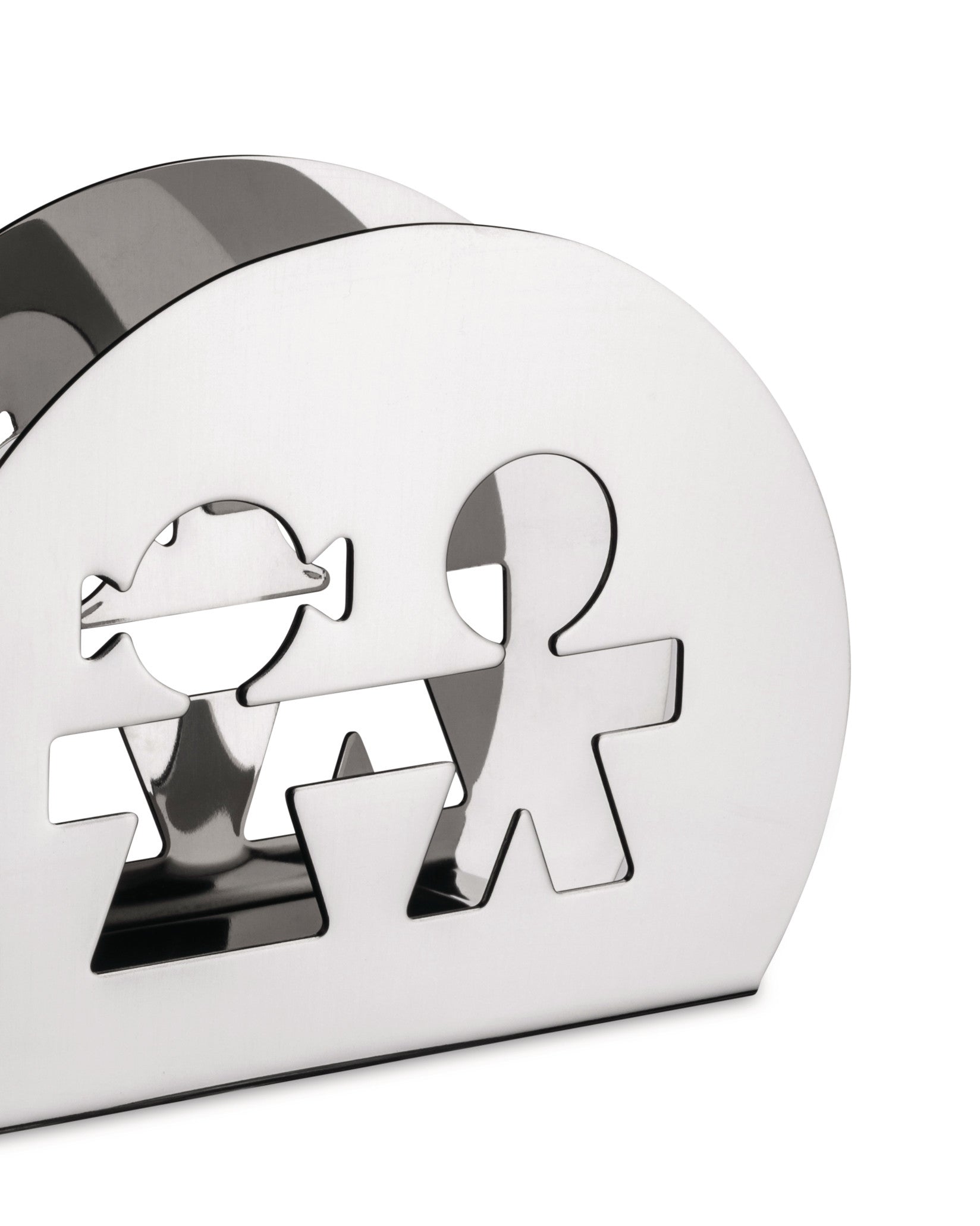 Silver polished metal napkin holder by Alessi, featuring cutout boy and girl figures, shown from a three-quarter angle.