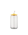 Clear glass storage jar with a yellow lid by Alessi, featuring a white cat figurine on top.