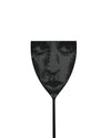 Black perforated fly swatter by Alessi, with a shield-shaped head and slender handle.