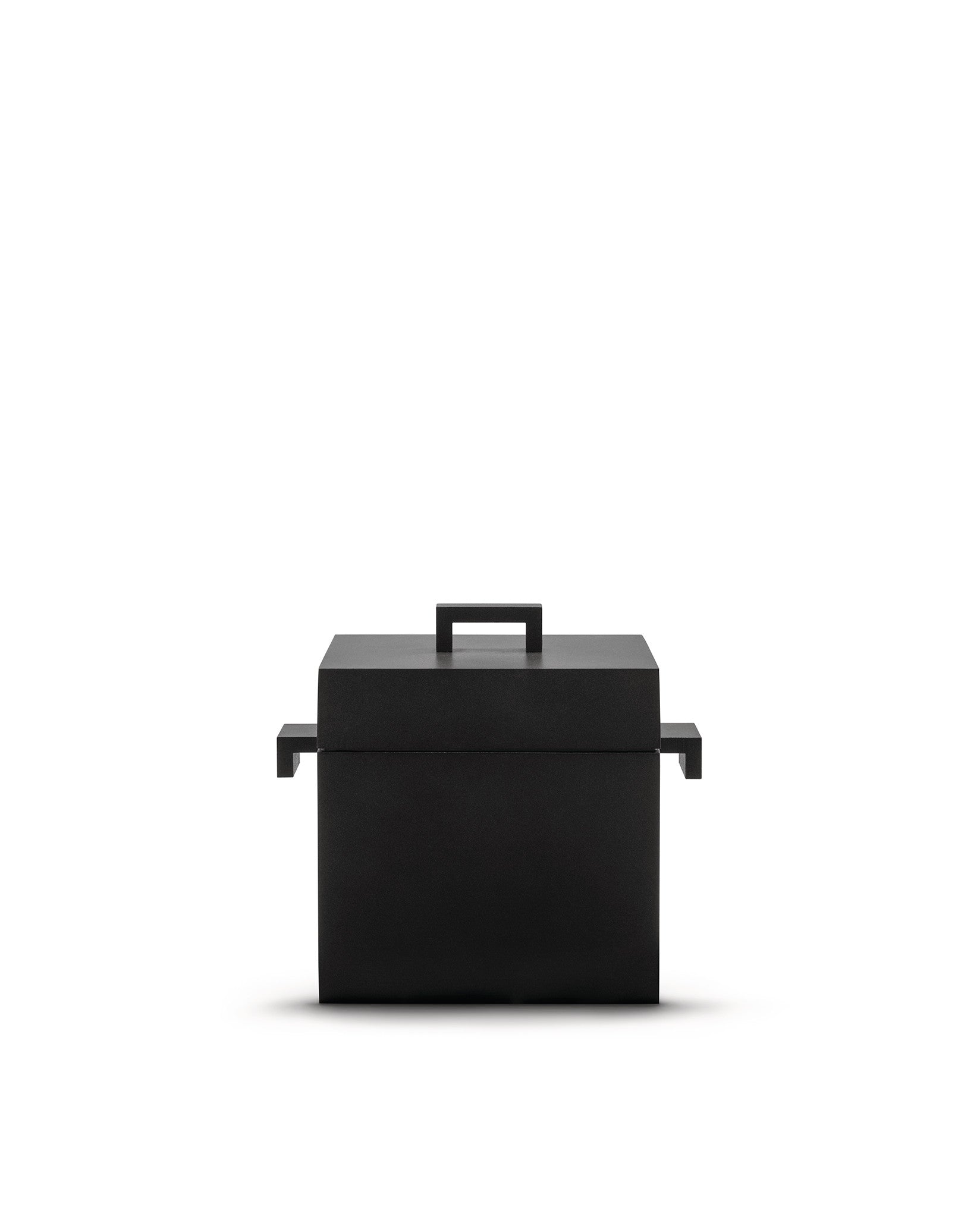 Matte black square pot by Alessi with a flat lid, central handle, and two geometric side handles.