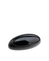 Black oval bread bin by Alessi with a sleek, glossy finish and curved top.