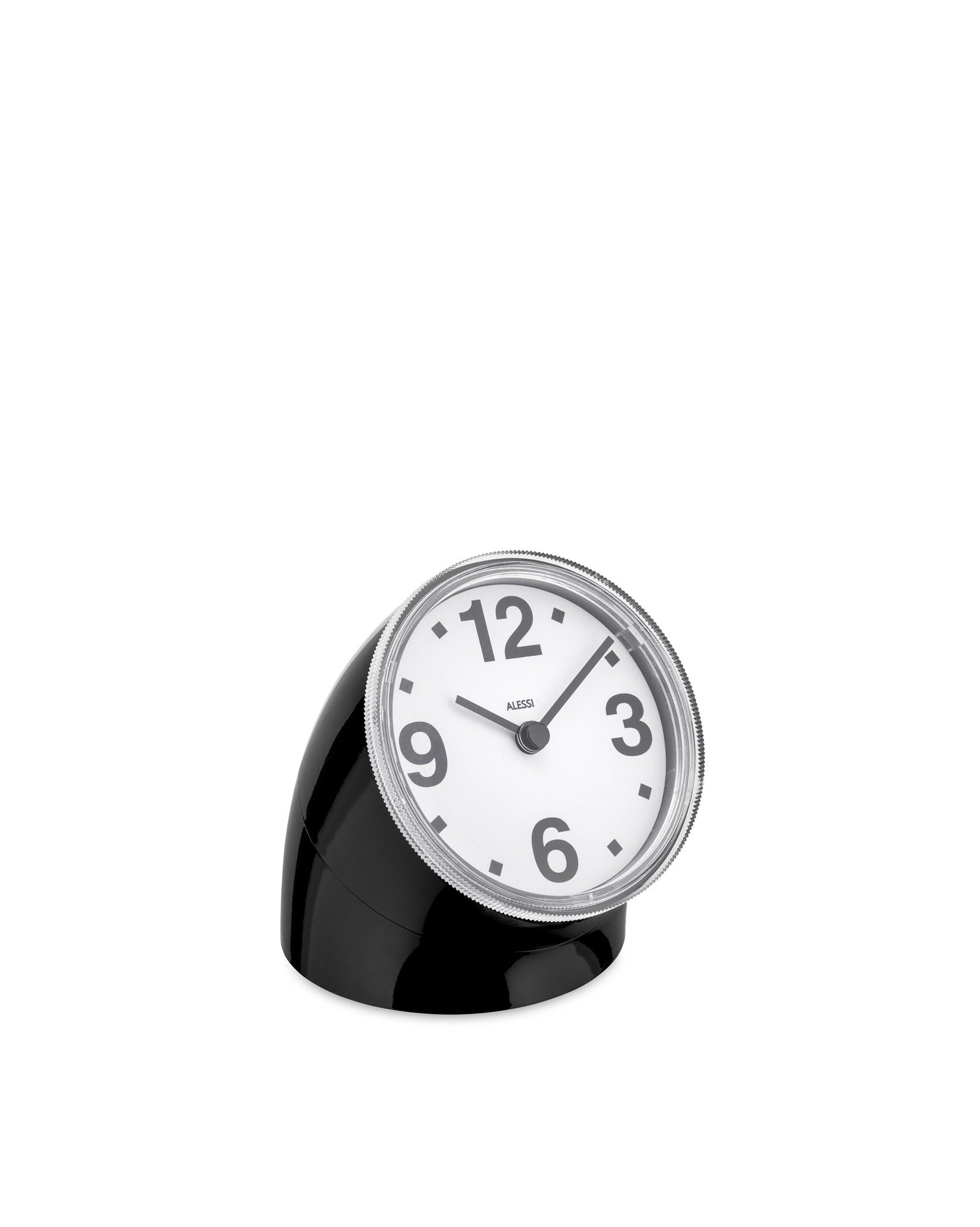 Black and white desk clock by Alessi, with a tilted face, large numbers, and a textured silver-toned rim.