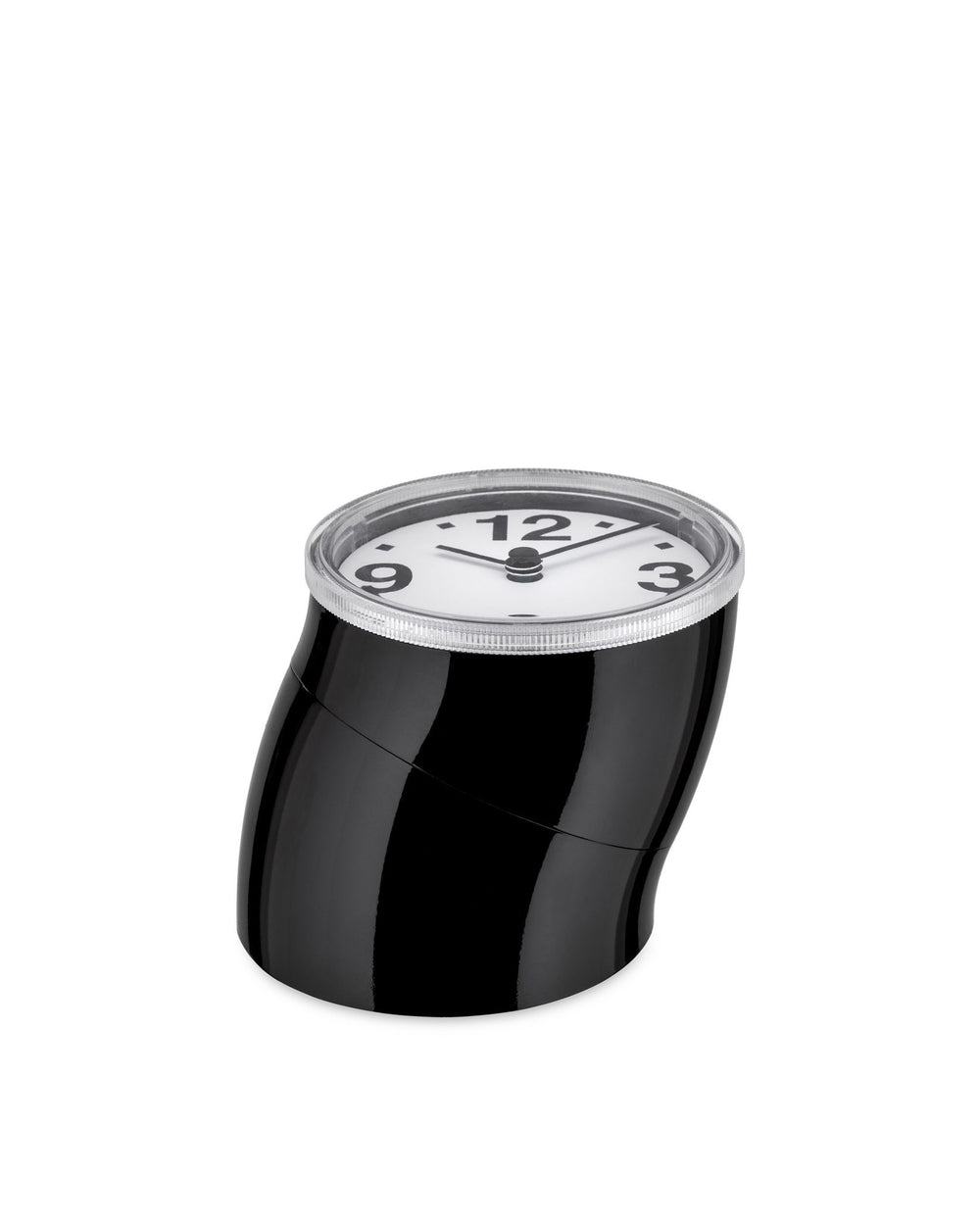 Black glossy alarm clock by Alessi, with a bent cylindrical body, clear top, and white face showing 3, 9, and 12.