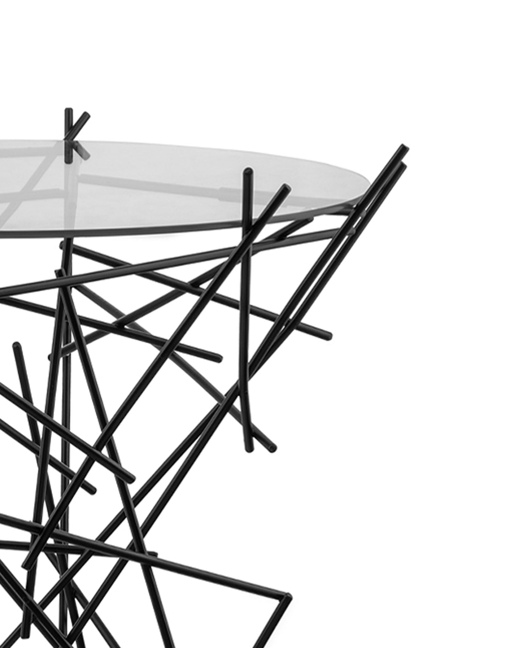 Black metal and glass side table by Alessi with an abstract stick base and clear round top.