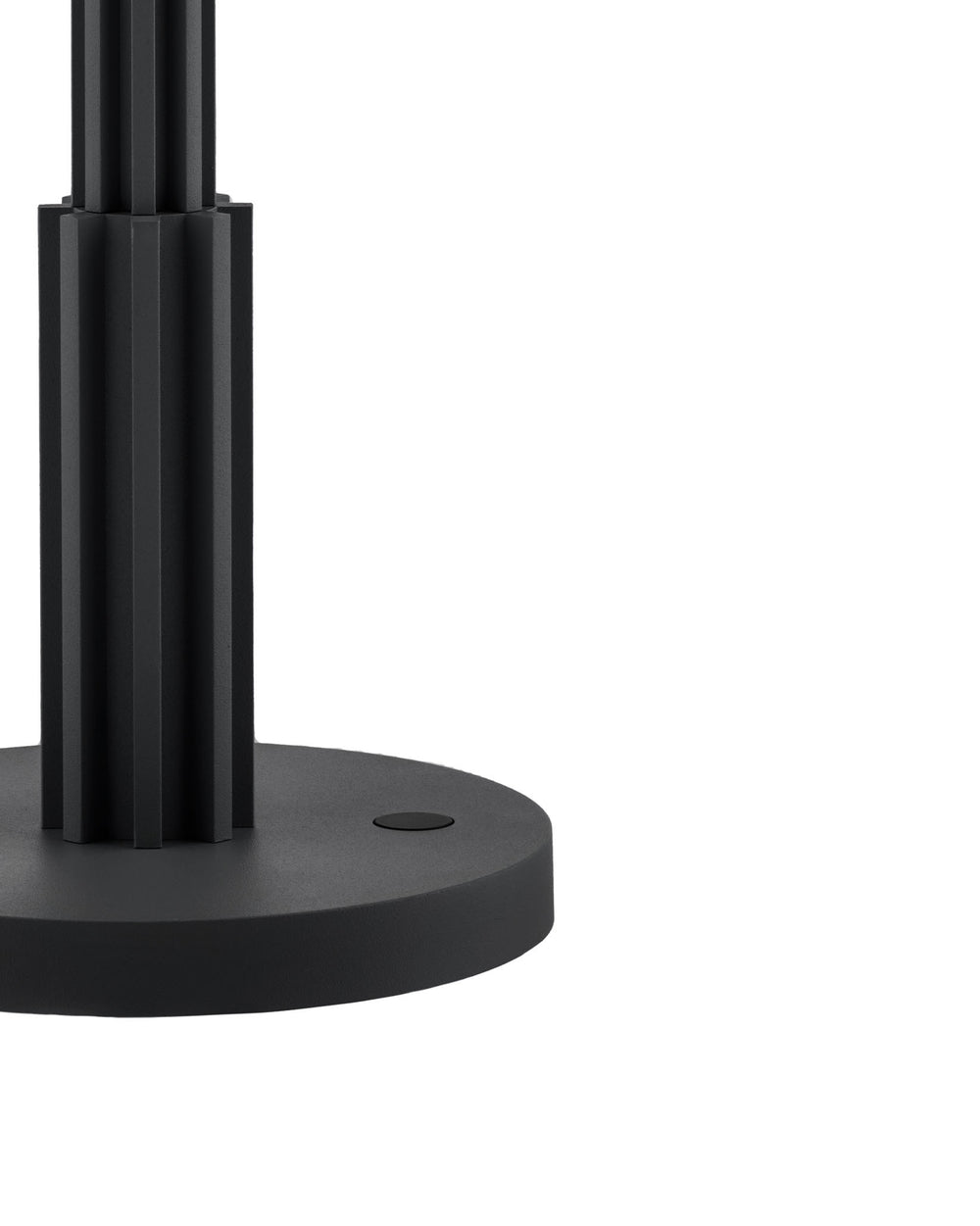 Black fluted column and round base by Alessi with a matte finish and oval detail.