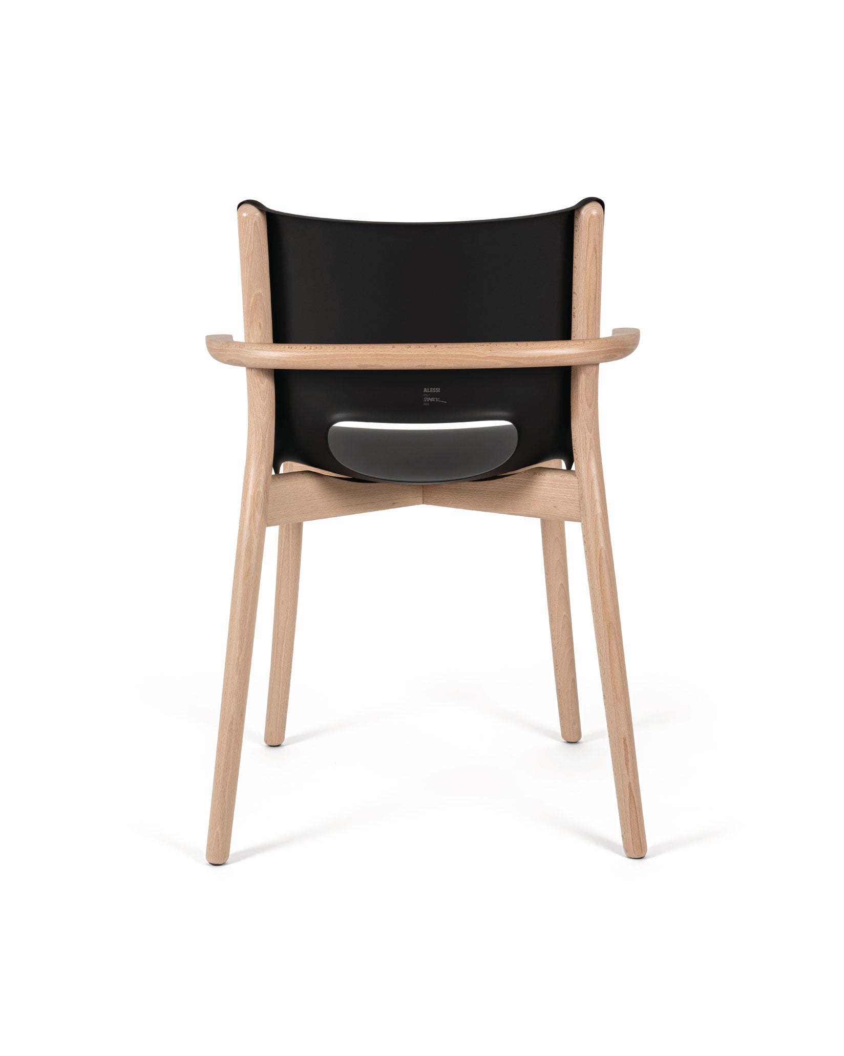 Black and light wood Poêle Collection chair by Alessi, with a curved wooden frame, armrests, and visible branding on the seat back.