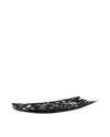 Black decorative bowl by Alessi, featuring an organic bark-like cutout design, presented from a low angle.