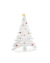 White metal decorative Christmas tree by Alessi with wavy branches, metallic red, gold, and silver ball ornaments, and a gold star.