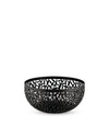 Black openwork decorative bowl by Alessi, featuring an intricate laser-cut leaf pattern.