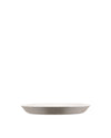A Tonale ceramic plate by Alessi, with a white interior and a light taupe exterior, shown in a side view.