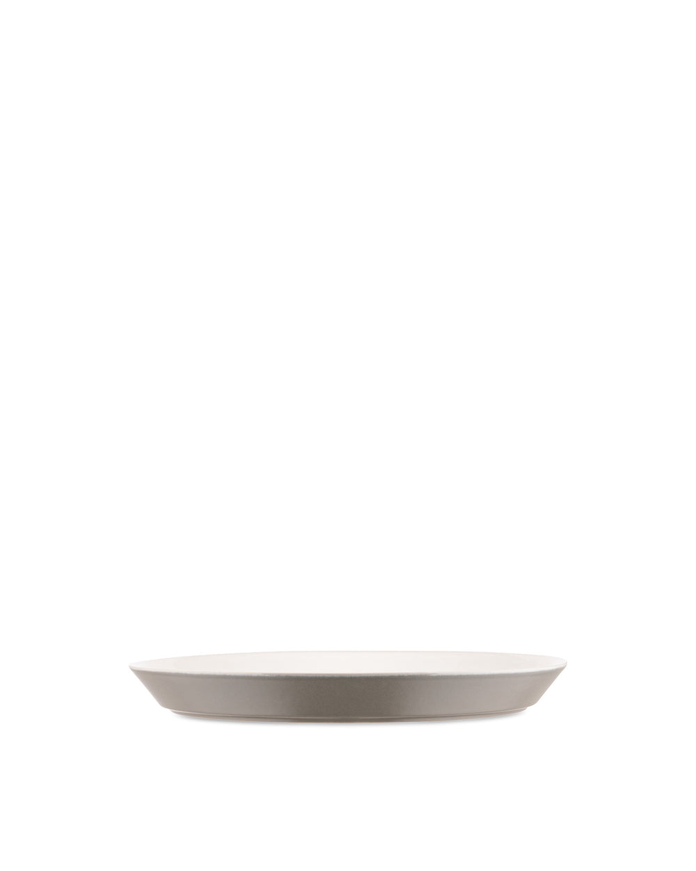 A Tonale ceramic plate by Alessi, with a white interior and a light taupe exterior, shown in a side view.