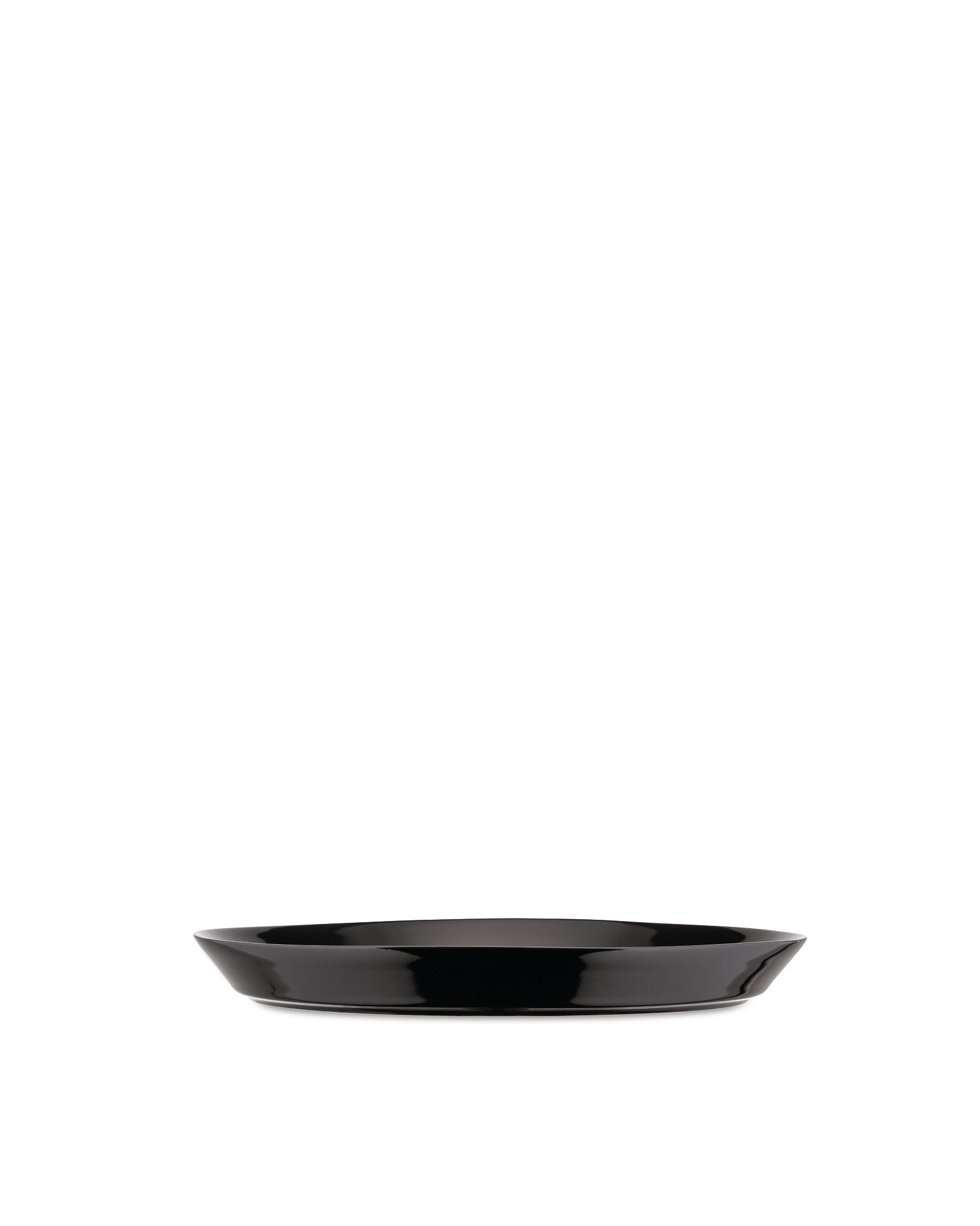 Black serving dish by Alessi with a glossy finish and gently curved sides, viewed head-on.