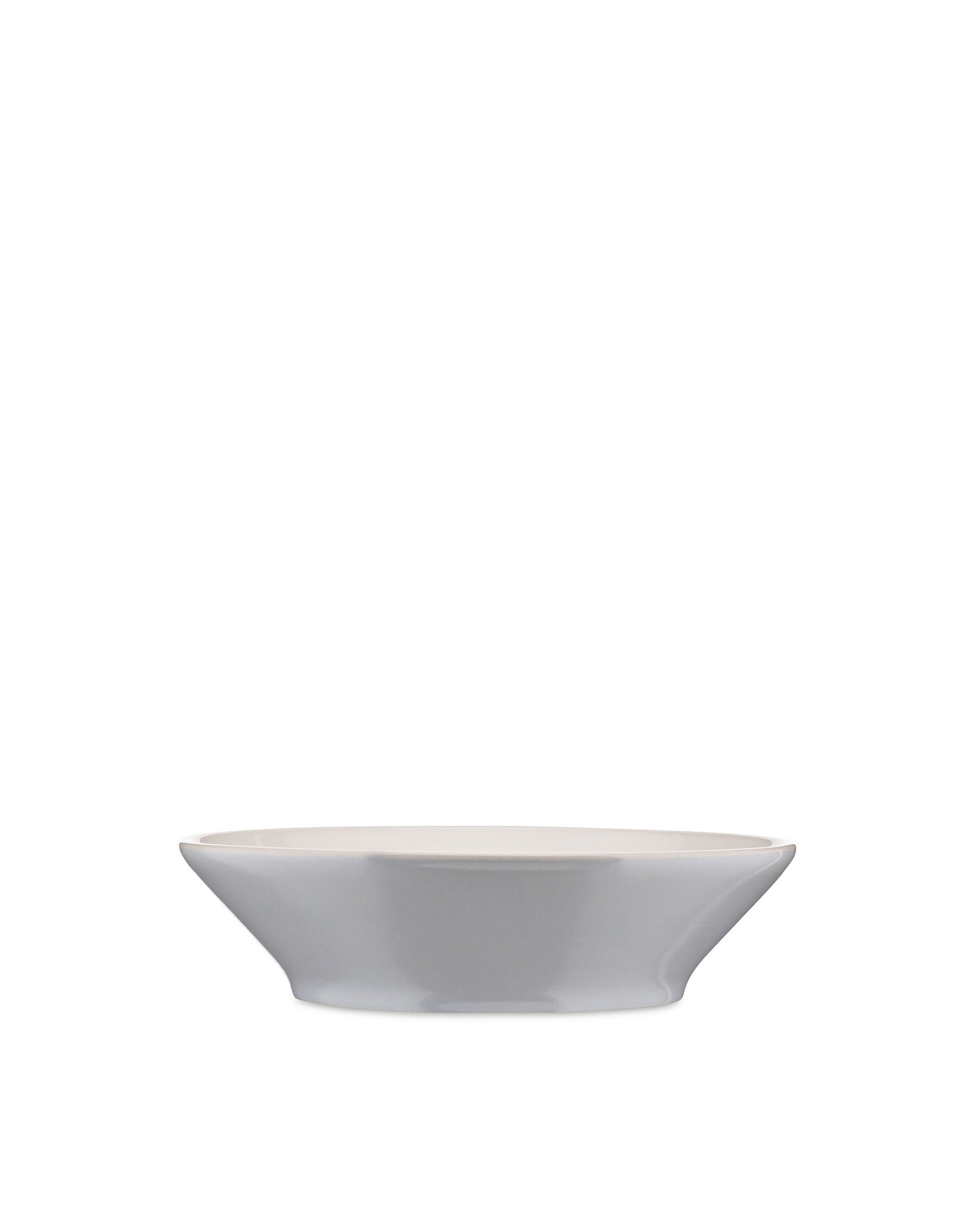 Light grey bowl by Alessi with a subtle flared shape and cream interior, side view.