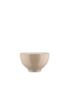 Smooth beige bowl by Alessi with a contrasting white interior and subtle base.