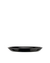 Black shallow serving plate by Alessi with a glossy finish and subtly curved sides.