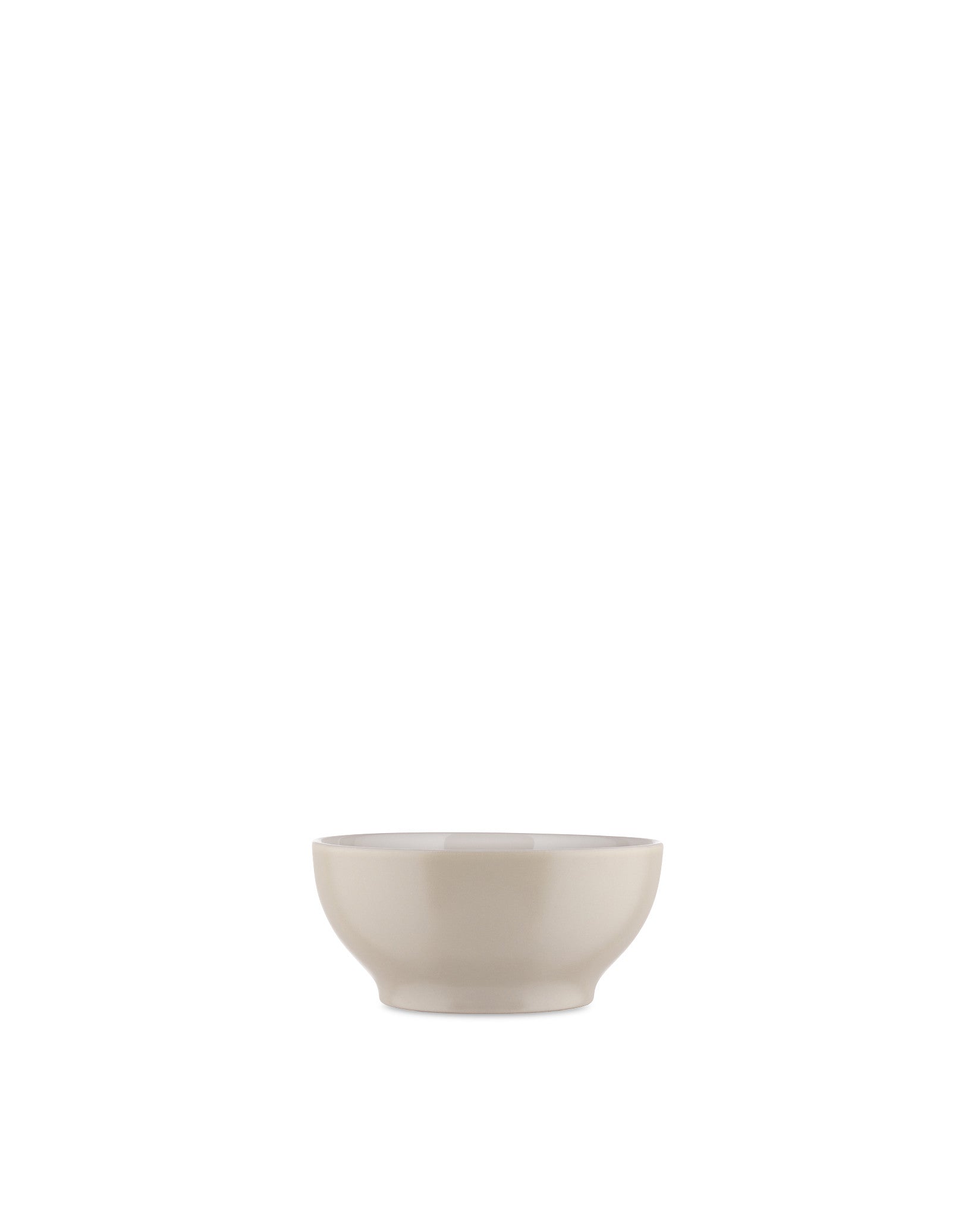 Smooth light beige ceramic bowl by Alessi, in a minimalist design, front view.