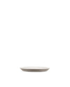 Light grey ceramic plate by Alessi with a subtle contrasting rim, side view.