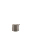 Gray ceramic creamer by Alessi with a smooth finish and pour spout.