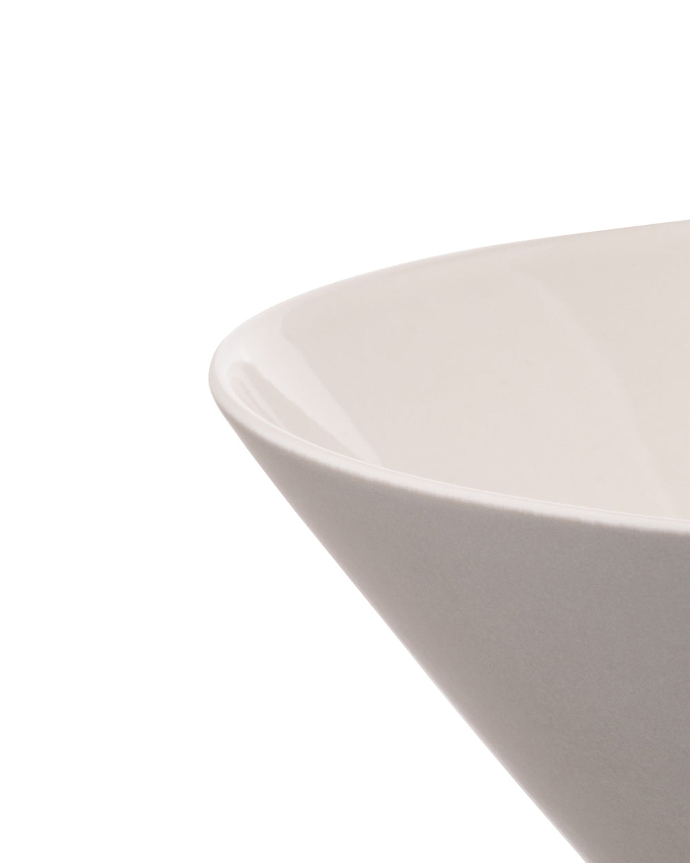 Creamy white ceramic bowl by Alessi with a tapered design and a smooth, glossy interior.