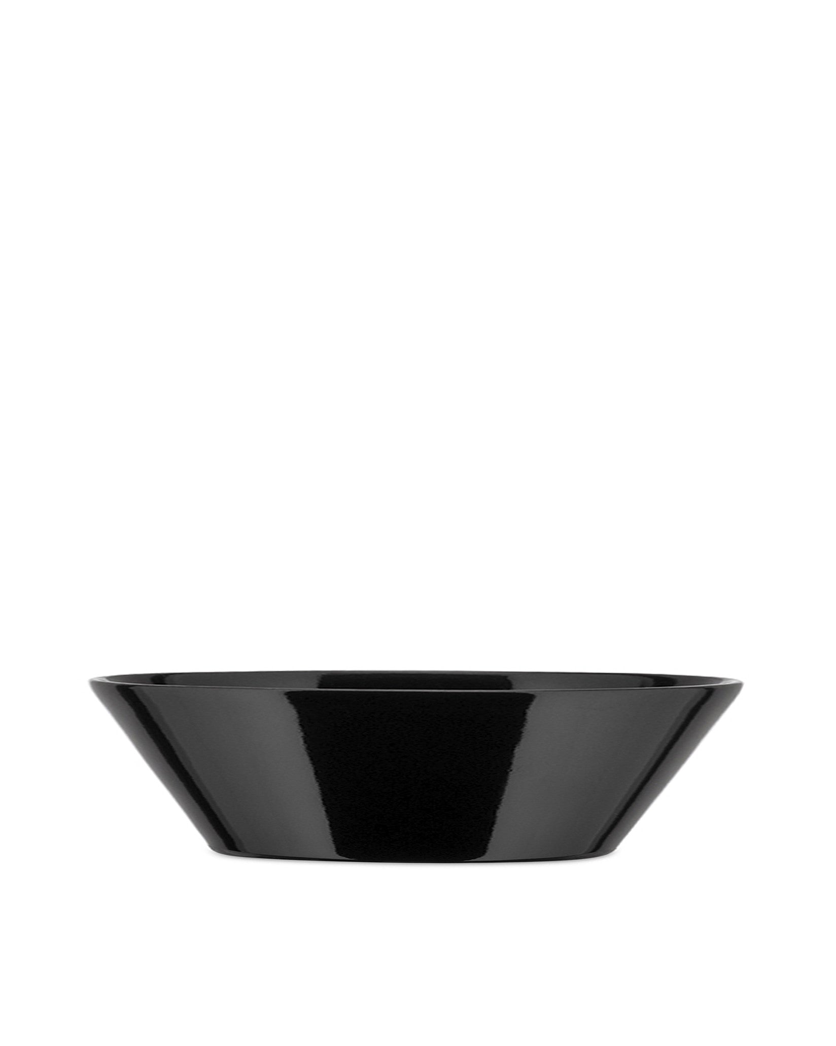 Black serving bowl by Alessi with a glossy finish and tapered sides, on a white background.