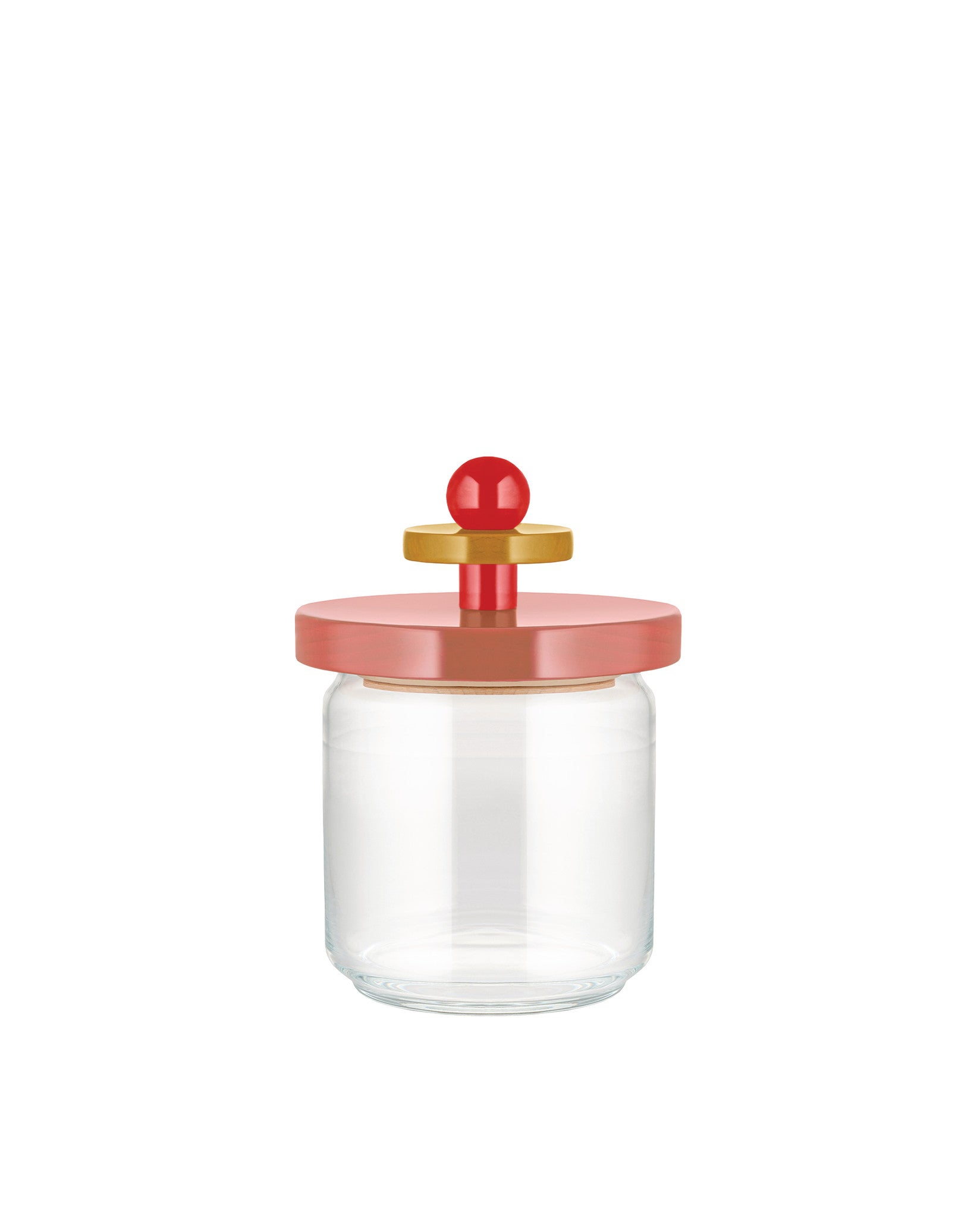 Clear glass storage jar by Alessi with a rose-colored lid, gold disk, and red spherical knob handle.