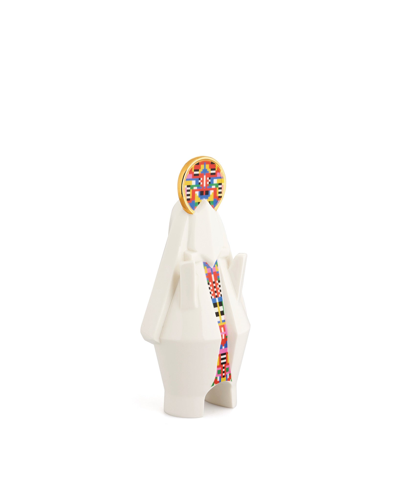 White faceted Mary statuette by Alessi with a gold halo and colorful pixelated patterns.